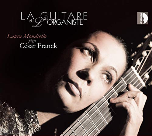 CD cover featuring Laura Mondiello, a guitarist, looking upwards.