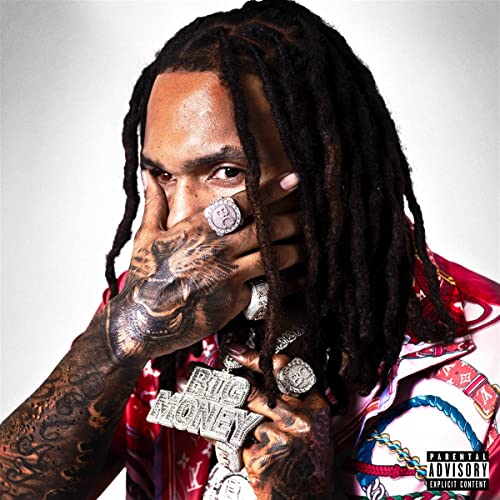 Rapper Money Man with dreadlocks, rings, and a "Big Money" necklace.