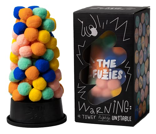 A tall, precarious tower of colorful fuzzy pom-poms next to its black product box.