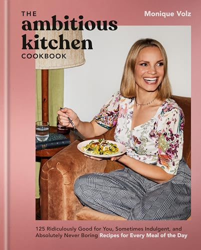Cookbook cover featuring Monique Volz and a plate of food on a couch.