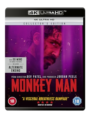 Blu-ray cover for "Monkey Man" featuring a bruised man behind purple bars.