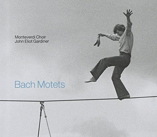 Black and white album cover with man balancing on tightrope, text "Bach Motets" in blue.