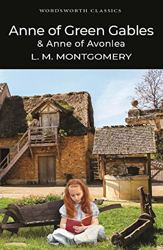 A young girl with red hair reads a book in front of a rustic cottage.