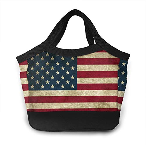 Small tote bag featuring a distressed American flag print with black trim and handles.