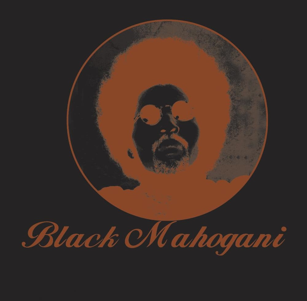 Album cover for Moodymann’s “Black Mahogani” featuring a portrait in orange.