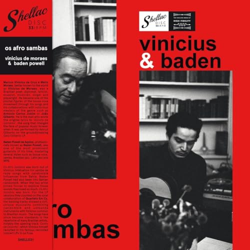 Vinyl album cover with red background, black text, and two black-and-white photos of musicians.