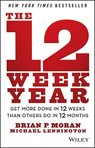 Book cover with large red numbers "12" and title "The 12 Week Year.