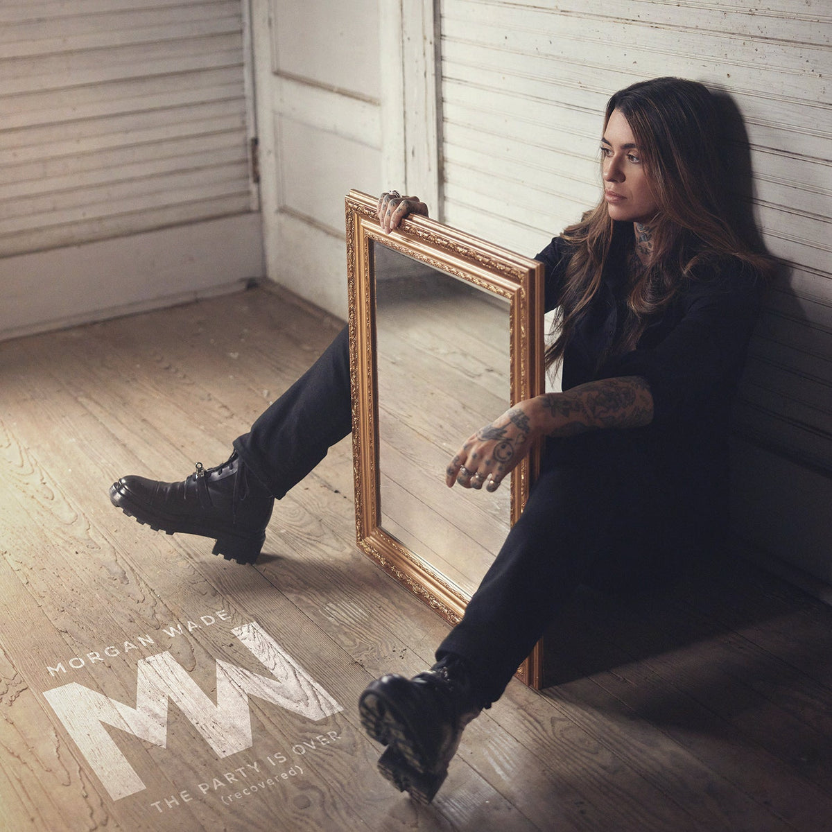 Morgan Wade album cover: woman with mirror, dark clothing, and tattoos.