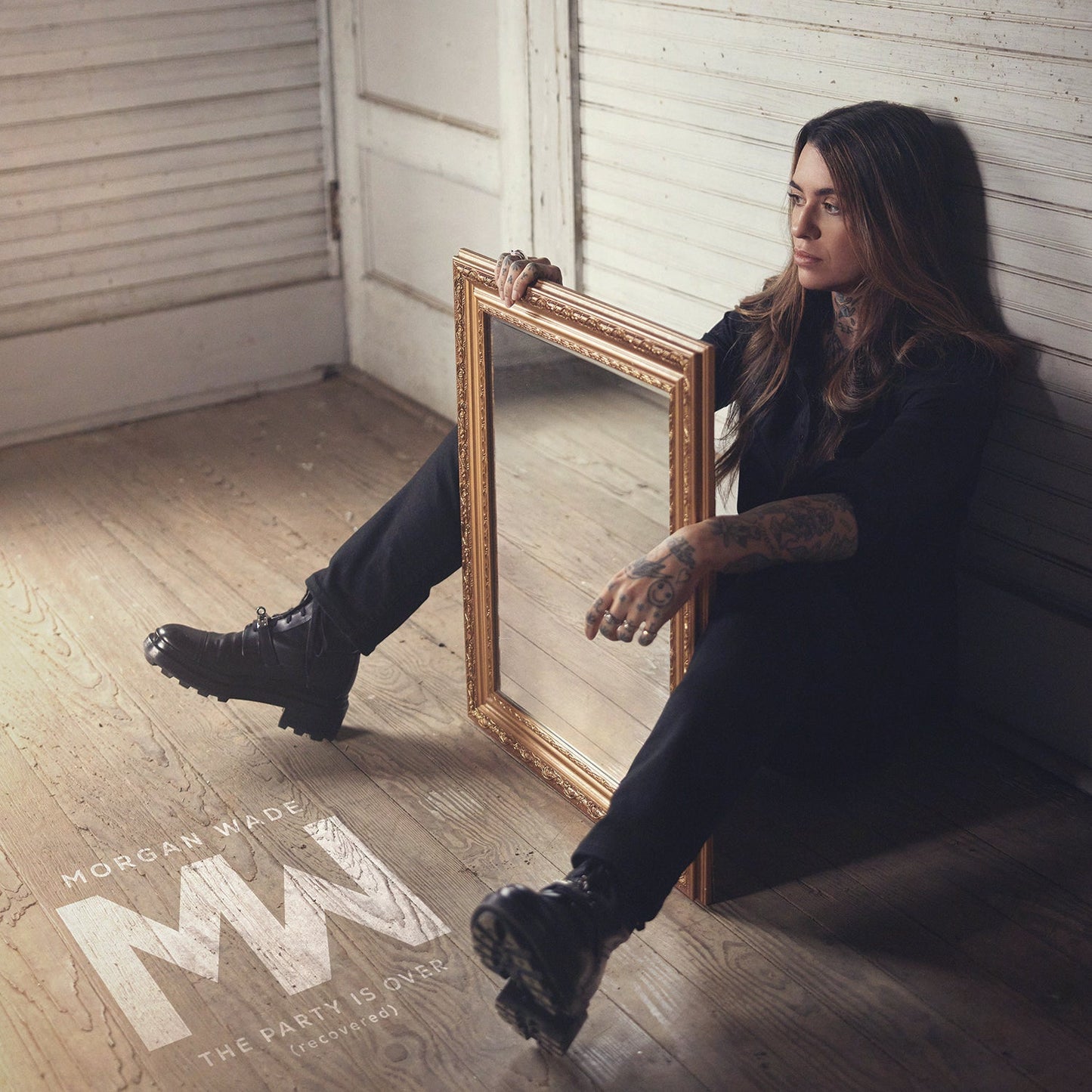 Morgan Wade album cover featuring a woman with a gilded mirror.