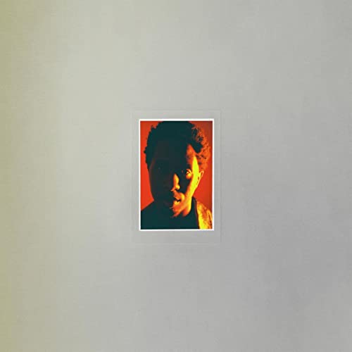 A portrait of a person against a red background centered on a grey cover.