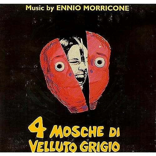 Vinyl album cover: a face split by red shapes with large eyes.