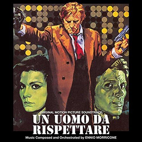 Film poster featuring a man with guns, and two faces below text.