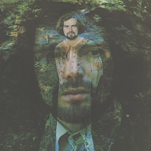 Van Morrison's album cover featuring a superimposed image of his face in a forest.