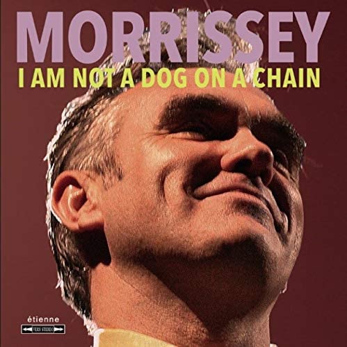 Morrissey's album cover featuring a close-up of his face against a red background.