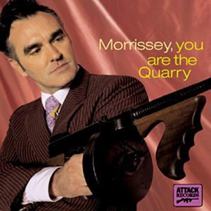 Morrissey holding a vintage submachine gun on album cover.