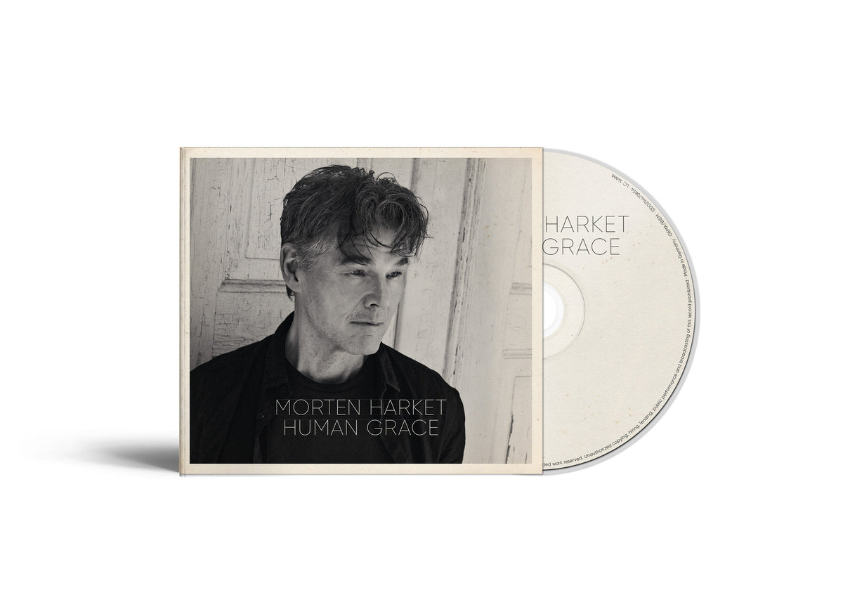 Morten Harket album "Human Grace" CD case and disc, sepia tone.