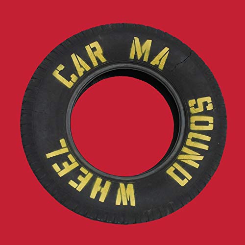 Black tire with yellow text on a red background.