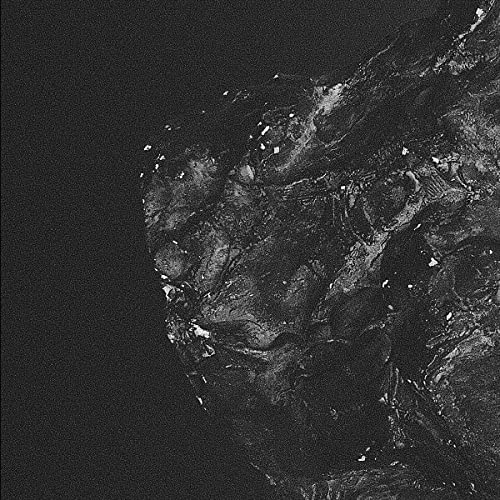 Black and white abstract image of textured surface, possibly snow.