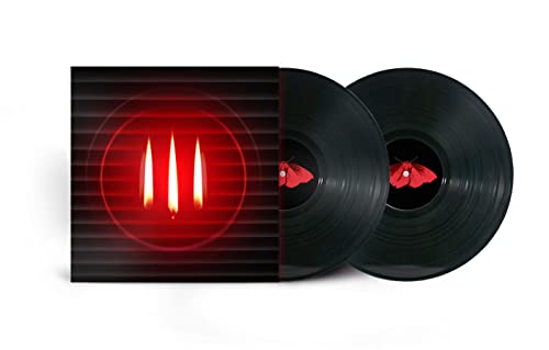 Two black vinyl records with red and black cover art featuring candles.