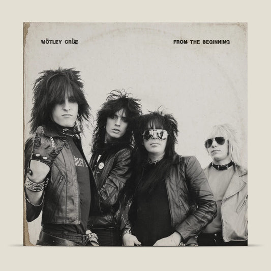 Black and white photo of Mötley Crüe, album cover for "From the Beginning".