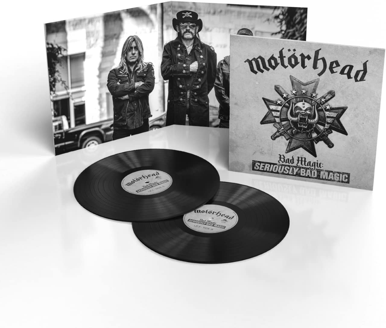 "Double vinyl records with 'Motörhead Bad Magic' album cover and band photo on gatefold."