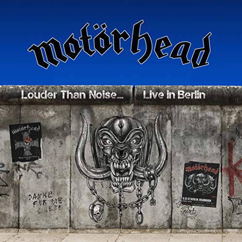 Motorhead album cover featuring a Snaggletooth logo on a concrete wall against blue sky.