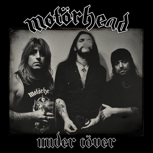 Black and white photo of Motörhead band members, album cover art.
