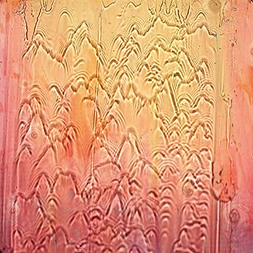 Abstract orange and pink textured vinyl record cover detail.