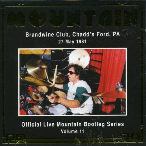 Drummer performing live on stage, CD cover for Mountain’s 1981 concert.