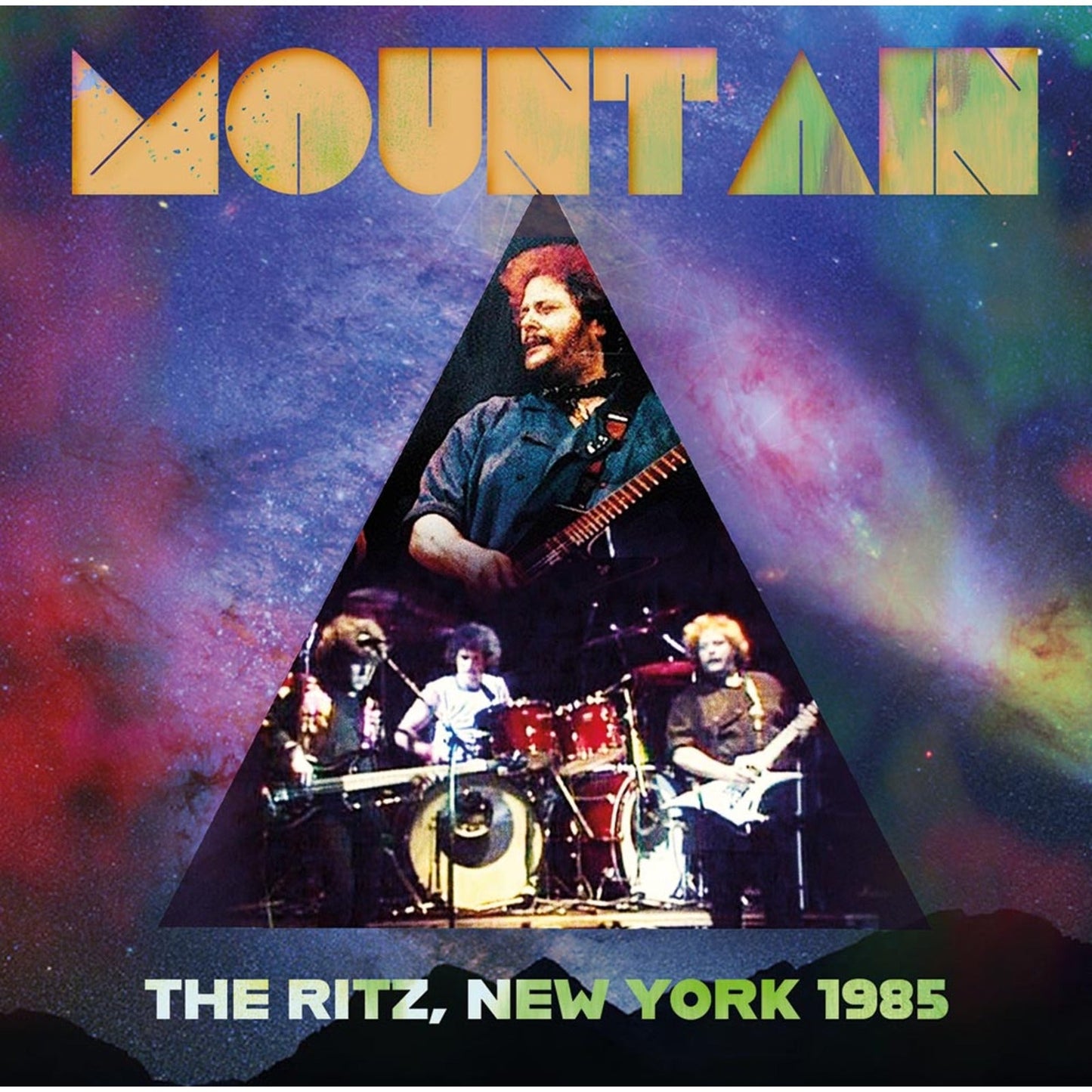Mountain band members performing on stage inside a triangle against a colorful galaxy background.