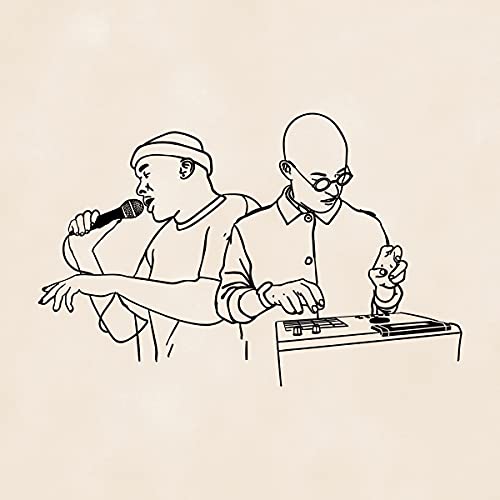 Two men, one with a mic and the other with a sound board.