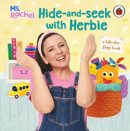 Ms. Rachel smiling with Herbie, a colorful character in a basket.