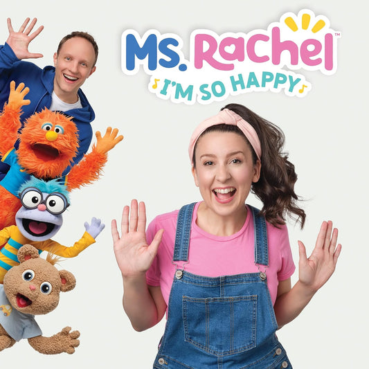 Ms. Rachel with colorful puppets, smiling and waving at the viewer.