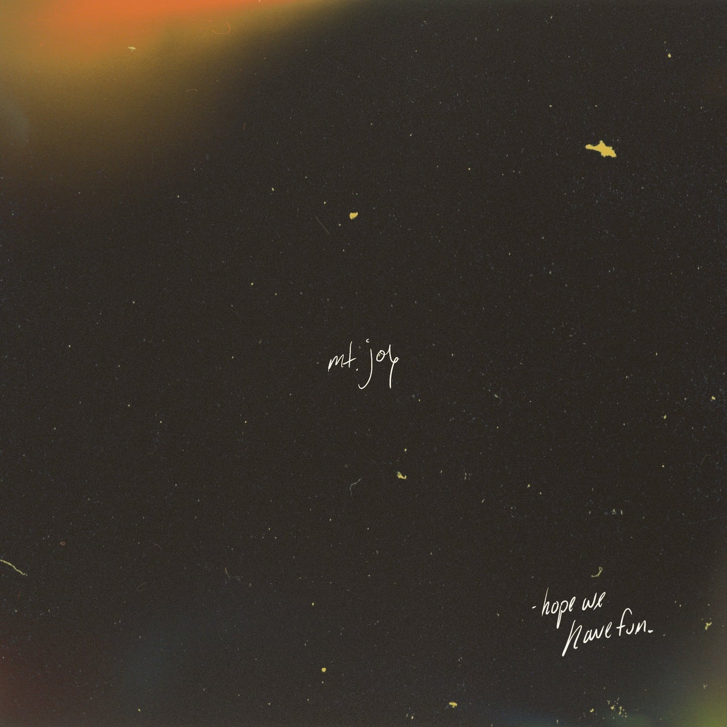Dark album cover with speckled texture and the text “mt. joy” and “hope we have fun.”