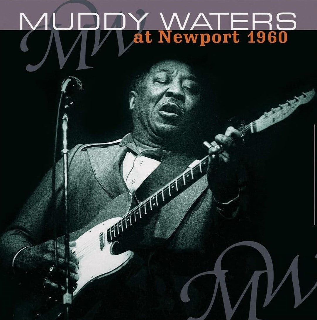 Muddy Waters playing electric guitar, album cover for “At Newport 1960”.