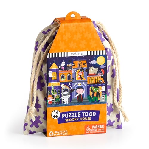 Orange and purple puzzle-in-a-bag depicting a haunted house with monsters.