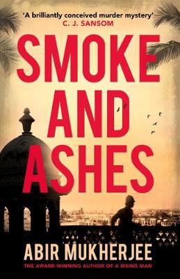 "Book cover with red title 'Smoke and Ashes' and cityscape silhouette at dusk."