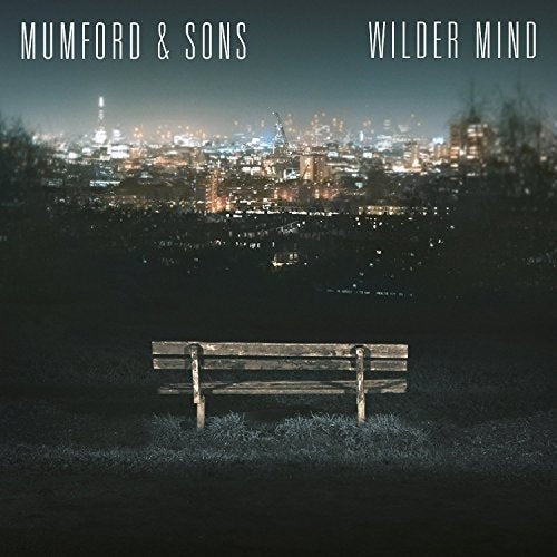Album cover for Mumford & Sons’ “Wilder Mind” featuring a park bench and city lights.