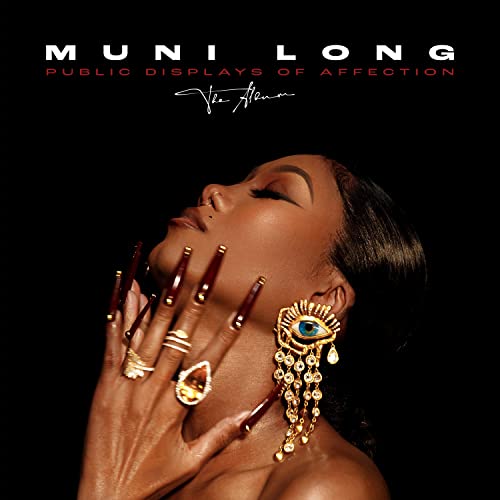 Muni Long album cover with a woman looking upwards, gold jewelry.