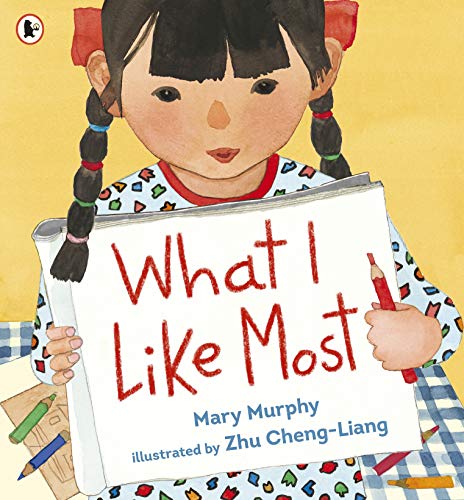 Children's book cover featuring a girl holding a sign reading "What I Like Most.