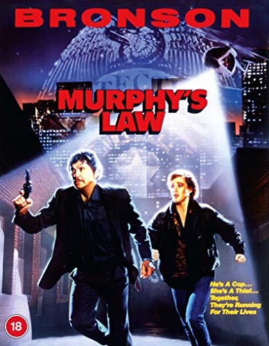 Charles Bronson and a woman running under a spotlight on a movie cover.