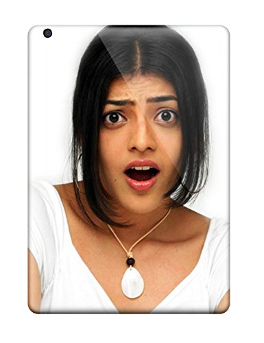 Woman with dark hair and surprised expression, portrait view.