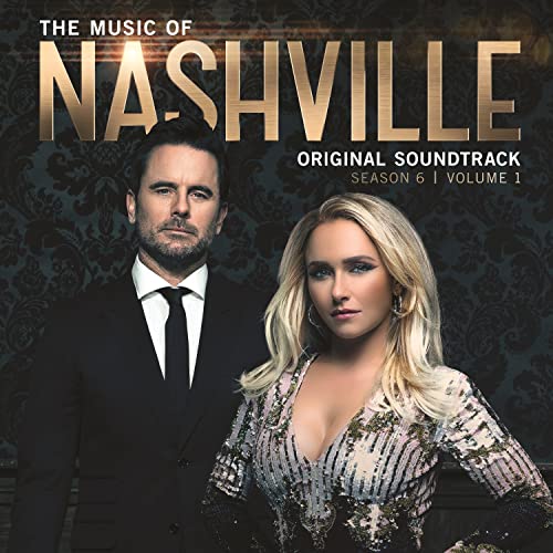 Album cover showing two people in formal attire against a dark patterned background.