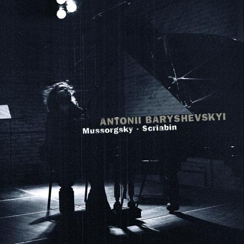 CD cover featuring a pianist at a grand piano in low light.