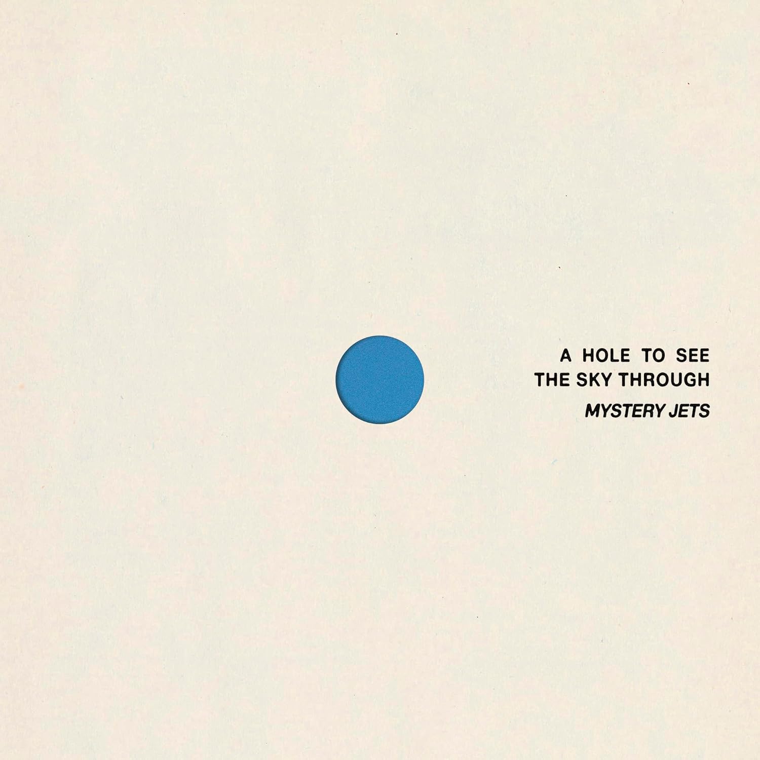 Album cover: pale yellow background with a blue circle and text.