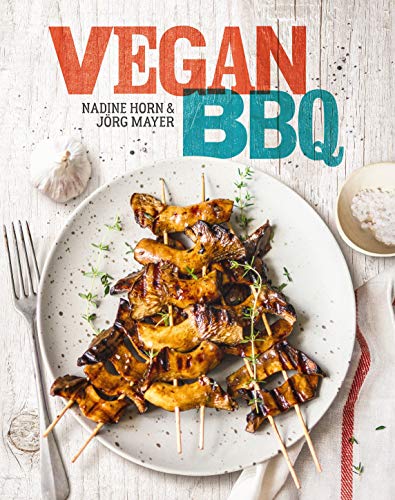 Book cover showing grilled mushroom skewers on a plate with a fork and garlic.