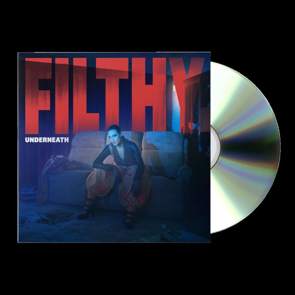 Nadine Shah sits on a sofa on the Filthy Underneath album cover with CD.