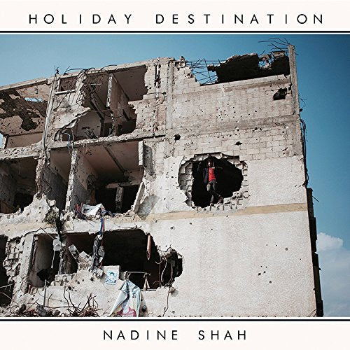 CD cover for Nadine Shah’s “Holiday Destination” featuring a damaged building.