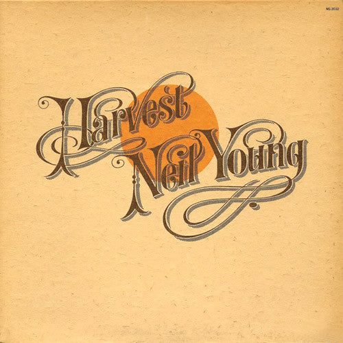Album cover for “Harvest” by Neil Young with orange sun and script text.