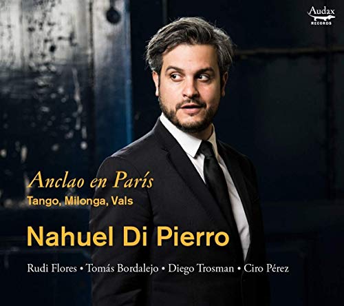 Man in a suit on a CD cover with text overlay and dark background.